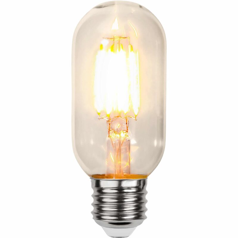 Die Leuchtmittelbirne mit Dämmerungssensor von Licht Factory hat einen sichtbaren Glühfaden, strahlt warmes 2100 K-Licht aus und verfügt über einen Metallschraubsockel mit klarem Glas, wodurch das komplizierte Glühfadendesign im Inneren zur Geltung kommt.