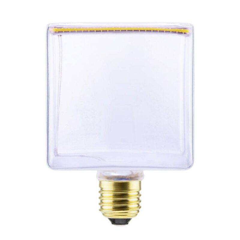 Die Leuchtmitte - Floatlight Cube 6W dimmbar klar 12,5cm von Licht Factory ist eine quadratische LED-Lampe mit einem Gehäuse aus klarem Glas und einem Standard-Schraubsockel. An der Oberkante befinden sich Leuchtdioden, ideal für die Modernisierung jedes Raums.
