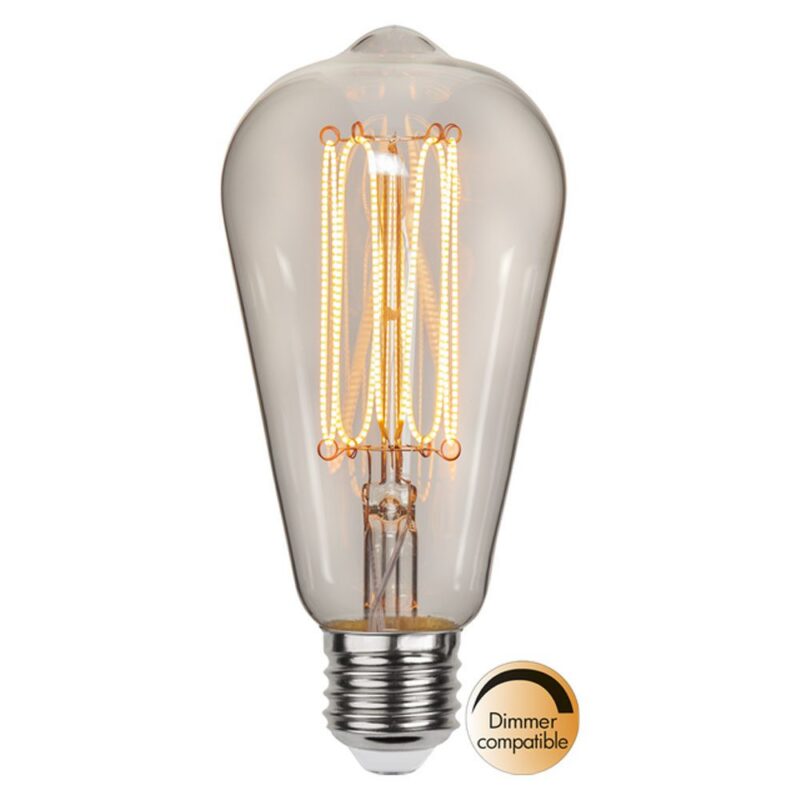 Die LED Kolben 3,8W 1800K dimmbar Ø6,4cm verfügt über ein sichtbares Glühfadendesign und einen Standard-Schraubsockel. Das diskrete Etikett bestätigt die Dimmerkompatibilität. Mit ihrer klassischen Tropfenform und dem warmen Licht verbindet diese Glühbirne auf wunderbare Weise Nostalgie mit moderner Technologie.