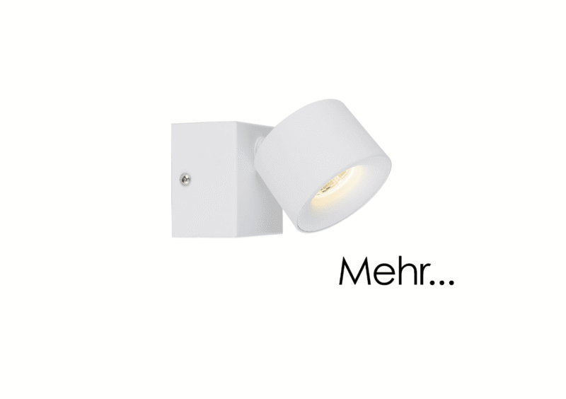 Ein Strahler namens Zog mit zylindrischem Design ist auf einem quadratischen Sockel montiert und wirft seitliches Licht. Der Strahler ist weiß, an der Wand montiert und auf der rechten Seite des Bildes erscheint das Wort „Mehr...“.