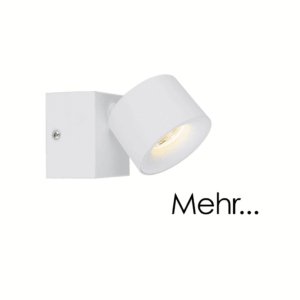 Ein Strahler namens Zog mit zylindrischem Design ist auf einem quadratischen Sockel montiert und wirft seitliches Licht. Der Strahler ist weiß, an der Wand montiert und auf der rechten Seite des Bildes erscheint das Wort „Mehr...“.
