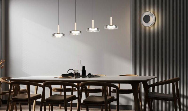 a dining table with chairs and a table with a group of lights from it