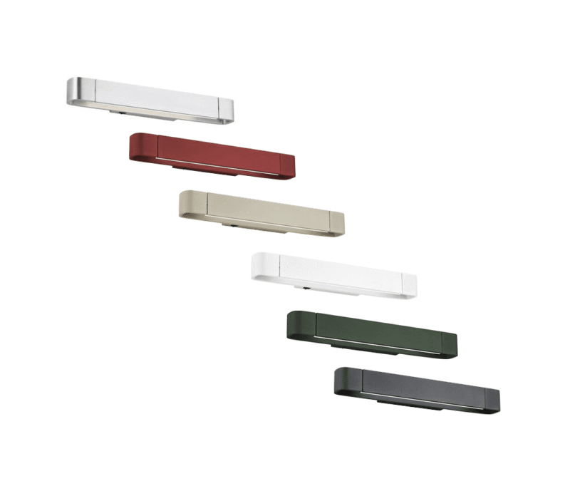 Sechs Wandleuchten - Lucy sind diagonal vor einem weißen Hintergrund angeordnet und in den Farben Silber, Rot, Beige, Weiß, Grün und Schwarz gehalten.