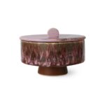 Die Bonbonschale „Berry mixed“ von HK Living ist ein Keramikbehälter mit einer gesprenkelten violett-braunen Glasur und verfügt über einen runden Deckel mit einem kleinen Griff oben, der auf einem kurzen, braunen zylindrischen Sockel ruht.