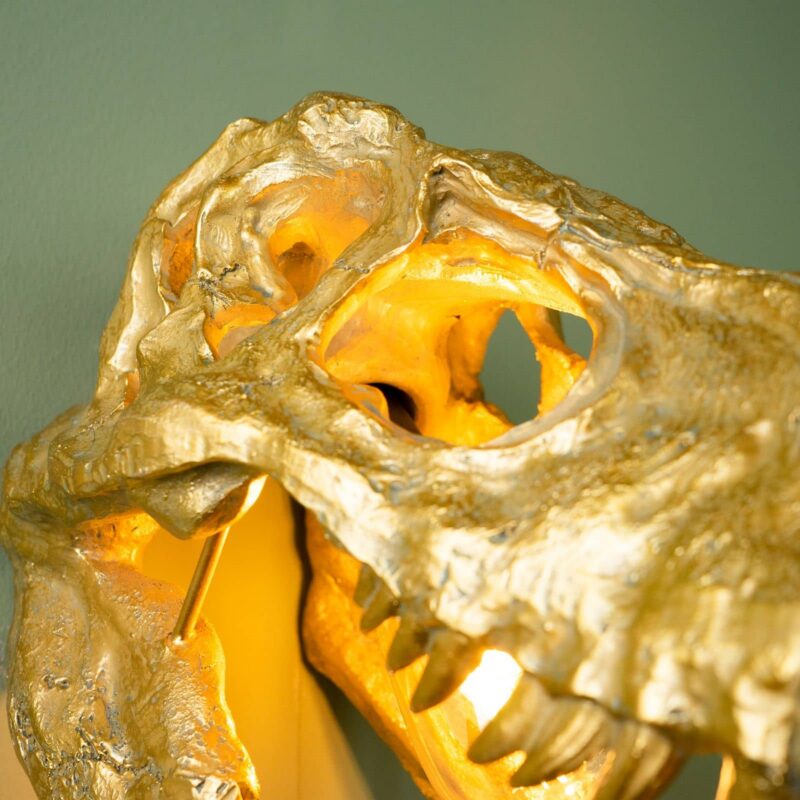 na bild von einem goldene skelet als Wandleuchte die leuchte befindet sich in ei em an zustand